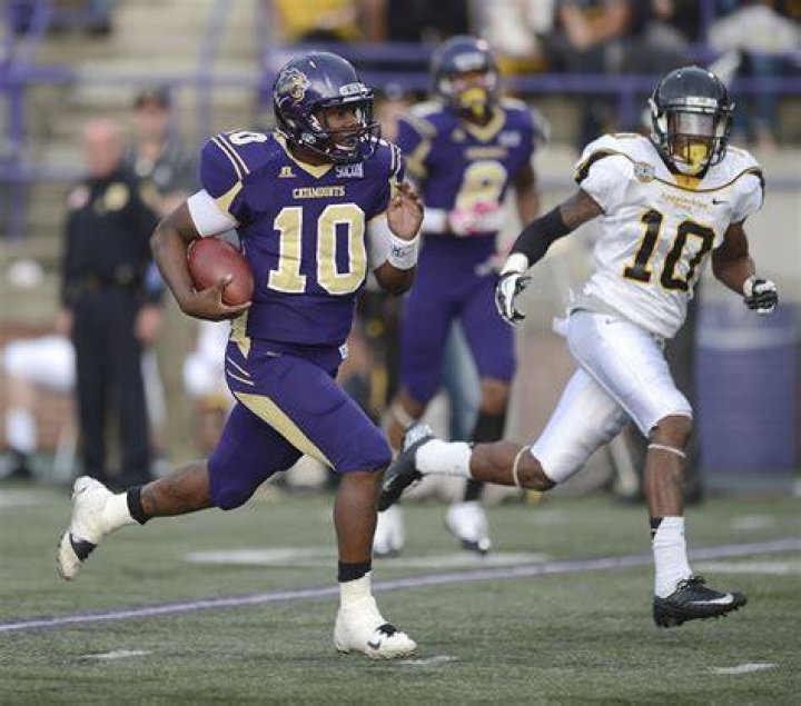 Catamount quarterback Troy Mitchell rushing for one of his two