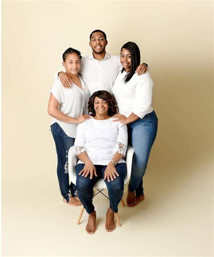 the family is posing for a photo together